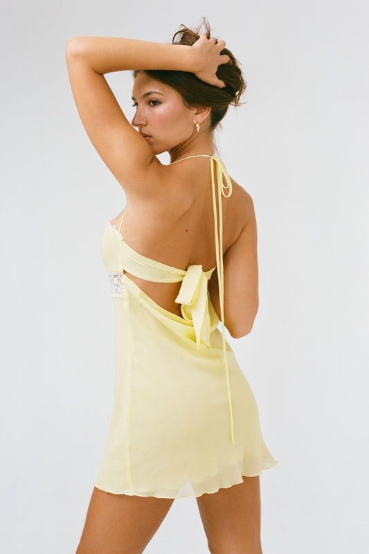 THE SCARLET DRESS IN YELLOW